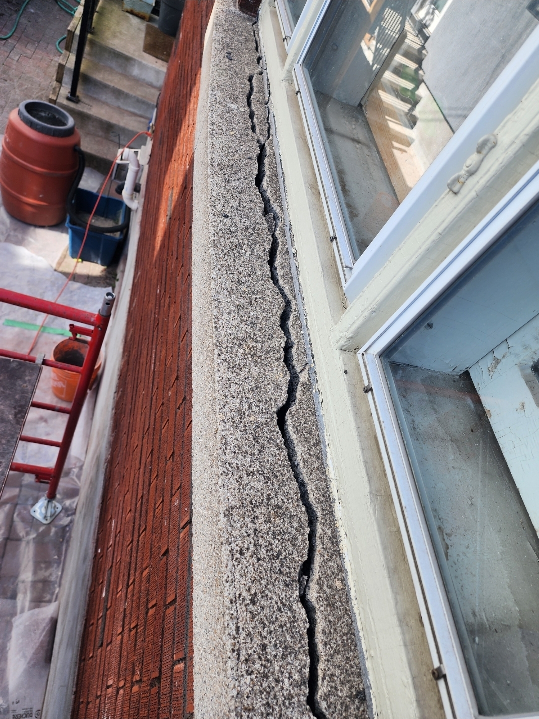 Failed masonry window sill before repair